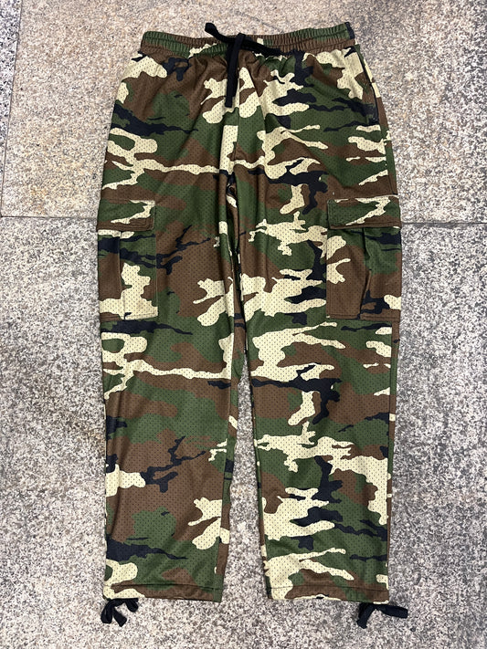 Camouflage-patterned pants on a gray floor